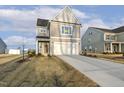 Two-story home with gray siding, manicured lawn, and a visible available sign in the front window at 573 Highview Drive Dr, Benson, NC 27504