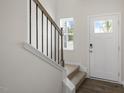 Inviting entryway with staircase, hardwood floors, and natural light at 160 Perseus St, Angier, NC 27501