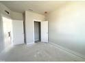 Simple bedroom with white walls and doors at 414 Fast Pitch Ln, Four Oaks, NC 27524