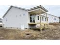 Side view of new house showing covered porch and deck at 472 Barbour Farm Ln, Four Oaks, NC 27524