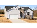 Attractive home with stone details, white siding, a two-car garage, and a well-maintained lawn at 472 Barbour Farm Ln, Four Oaks, NC 27524