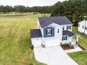 Attractive two-story home with a golf course view at 576 Barbour Farm Ln, Four Oaks, NC 27524