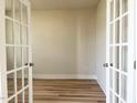 Bright office space with hardwood floors, French doors, and neutral paint, ideal for remote work at 576 Barbour Farm Ln, Four Oaks, NC 27524