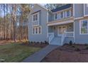 Front entrance with stairs and walkway, light blue siding at 8780 Old Nc 86, Chapel Hill, NC 27516