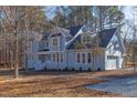 Two-story house, light blue siding, white trim, attached garage at 8780 Old Nc 86, Chapel Hill, NC 27516