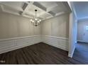 Elegant dining room featuring a chandelier and wainscoting at 99 Mapledale Ct, Benson, NC 27504