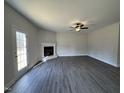 Spacious living room with corner fireplace and hardwood floors at 99 Mapledale Ct, Benson, NC 27504