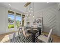 Bright dining room with natural light, designer lighting, and stylish decor at 7417 Dover Hills Dr, Wake Forest, NC 27587