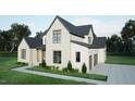 Beautiful two-story home featuring a brick and clapboard facade with black frame windows and a two car garage at 3612 Bailey Meadows Drive Dr, Wake Forest, NC 27587