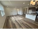 Spacious living room with hardwood floors and natural light at 1111 Woody Dr, Graham, NC 27253