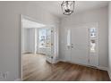 Bright entryway features wood-look floors and a modern light fixture at 134 Black Walnut Dr # 205, Garner, NC 27529