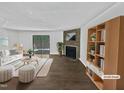 Inviting living room with fireplace and sliding glass doors to the backyard at 104 Mossbark Ln, Chapel Hill, NC 27514