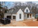 New construction home with attached garage featuring painted brick and gray siding at 1101 Manchester, Raleigh, NC 27609