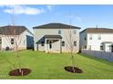 A spacious backyard is complemented with two newly planted trees and views of neighboring homes at 808 Challenger Ln, Knightdale, NC 27545