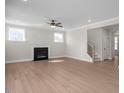 Large living room featuring hardwood floors and a gas fireplace at 5017 Trotter Dr, Raleigh, NC 27603