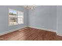 Bright dining room with a chandelier, light blue paint and white trim at 100 N Ridge View Way, Franklinton, NC 27525
