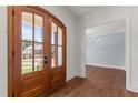 Warm and inviting foyer with hardwood floors and a view into the dining room at 100 N Ridge View Way, Franklinton, NC 27525