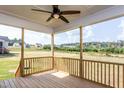 Relaxing screened porch with wood flooring and scenic backyard view at 5828 Genesee Dr., Homesite 9, Durham, NC 27712