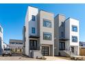 Contemporary townhome boasts clean lines, large windows, and modern architectural details in a desirable neighborhood at 227 Woodsborough Pl, Raleigh, NC 27601
