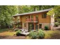 Mid-century modern home with deck and wooded lot at 4416 Arrowhead Trl, Hillsborough, NC 27278