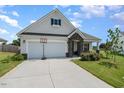 Two-car garage and inviting front entryway at 71 Nolan Ct, Lillington, NC 27546