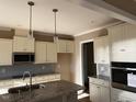An unfinished kitchen featuring modern stainless steel appliances and white cabinetry at 981 Olive Branch Dr, Smithfield, NC 27577