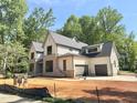 Beautiful new construction home with a three-car garage and meticulous design at 7208 Tanbark Way, Raleigh, NC 27615