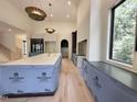 Bright, large kitchen boasting a center island, plenty of cabinets, and natural light at 7208 Tanbark Way, Raleigh, NC 27615