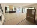 Bright and airy living space with open floor plan, modern staircase, and expansive sliding glass doors at 7208 Tanbark Way, Raleigh, NC 27615