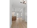 Bright entryway with hardwood floors leading to an open-concept layout at 100 Bold Dr, Youngsville, NC 27596