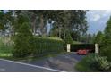 Private gated entrance with landscaping at 5909 Tower Grove Dr, Raleigh, NC 27614