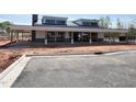 Community building exterior featuring a covered patio with columns and a flat roof at 195 Anise Ln, Garner, NC 27529