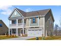 Attractive home featuring a two-car garage and a cozy balcony on the second floor at 2820 Lacy Holt Rd, Graham, NC 27253