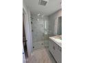 Modern bathroom featuring a glass-enclosed shower and updated fixtures at 1349 Bessie Ct, Wake Forest, NC 27587