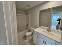Well-lit bathroom featuring a vanity and shower-tub combo at 1351 Bessie Ct, Wake Forest, NC 27587