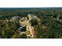 Aerial view of a luxury community nestled among lush trees at 4908 Foxridge Dr, Raleigh, NC 27614