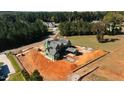Aerial view of new construction home with a gray shake roof and green exterior wrap with backyard terrace construction at 705 Parker Creek Dr, Raleigh, NC 27614