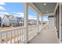 Spacious porch with white railings, offering neighborhood views and outdoor relaxation at 9237 Kitchin Farms Way # 429, Wake Forest, NC 27587