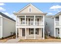 Inviting two-story home showcasing a covered front porch, perfect for relaxing outdoors at 9237 Kitchin Farms Way # 429, Wake Forest, NC 27587