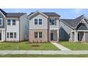 Charming two-story home with a landscaped yard and covered front entrance at 733 Portland Rose Dr, Knightdale, NC 27545