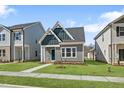 Inviting home exterior with a manicured lawn and blue sky at 737 Portland Rose Dr, Knightdale, NC 27545