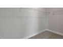 Spacious walk-in closet featuring ample shelving to store clothing and accessories at 1660 Piney Falls Dr, Wendell, NC 27591