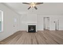 Bright and airy living room showcasing a cozy fireplace and neutral walls at 63 Falls River Ct, Broadway, NC 27505