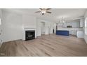 Spacious open-concept living room featuring a fireplace and hardwood flooring at 63 Falls River Ct, Broadway, NC 27505