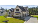 Charming two-story home with a 2-car garage and landscaped yard at 30 Spanish Oak Dr, Youngsville, NC 27596