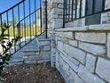 Detailed view of the stone work and steps leading to the home's entrance at 199 Grand Griffon Way, Lillington, NC 27546