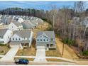 A stunning aerial view captures a desirable neighborhood with meticulously maintained homes and picturesque landscaping at 313 Mason Oaks Dr, Wake Forest, NC 27587
