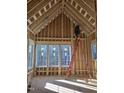 Bright living room featuring large windows, natural light, and exposed beams being constructed at 3325 Colby Chase Dr # 9, Apex, NC 27539