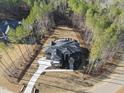 Elevated view of a beautiful home nestled in a wooded lot at 7640 Falls Creek Ln, Raleigh, NC 27614