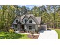 Desirable two-story home with an attached garage and a lush green front lawn at 330 Hidden Lake Dr, Youngsville, NC 27596